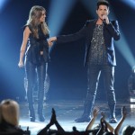 Angie performs with Adam Lambert