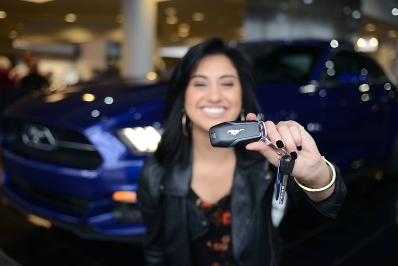 Jena Irene shows off the keys to her ride